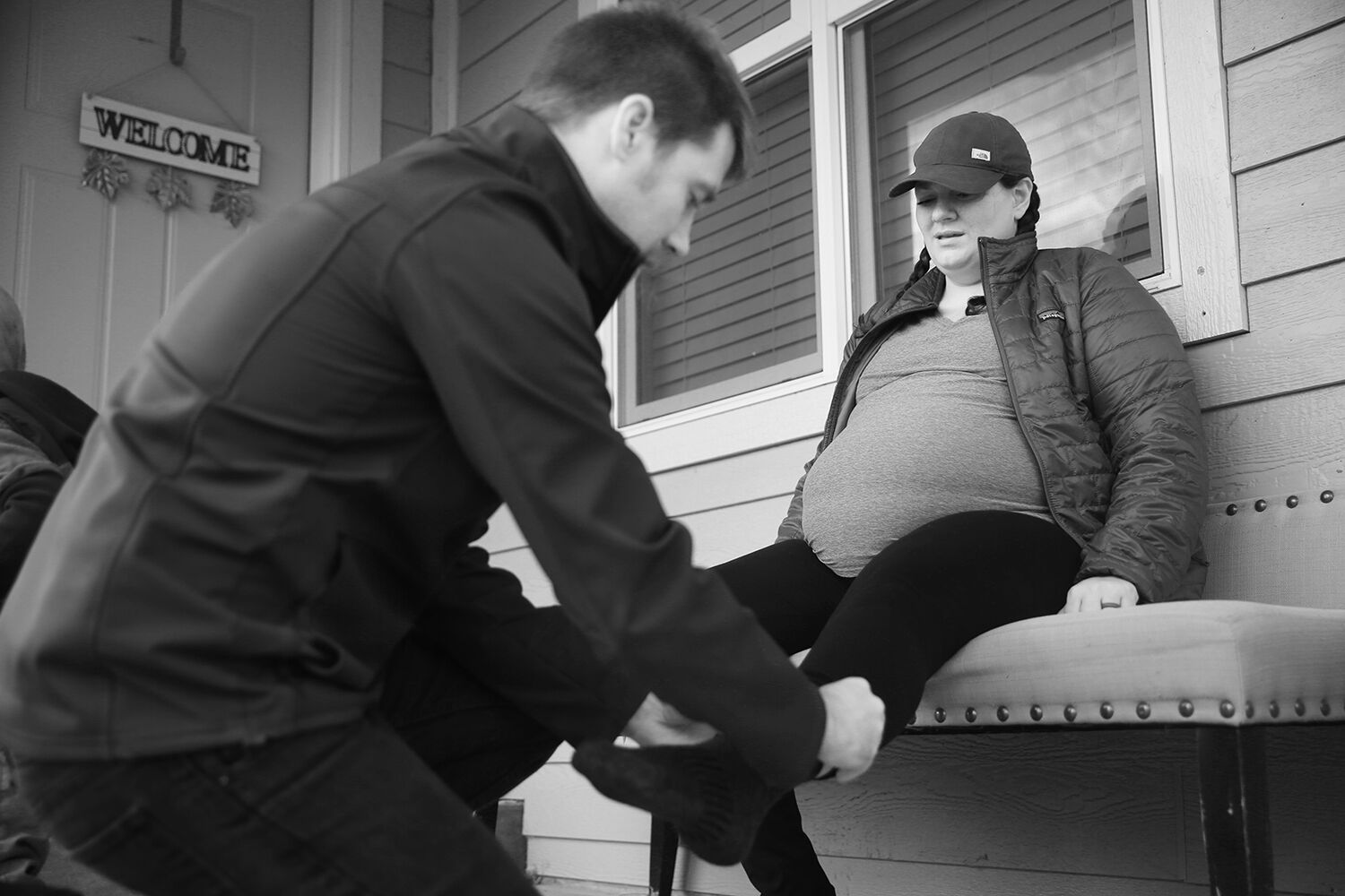 Jalissa waited for Josh to help put on her shoes and socks